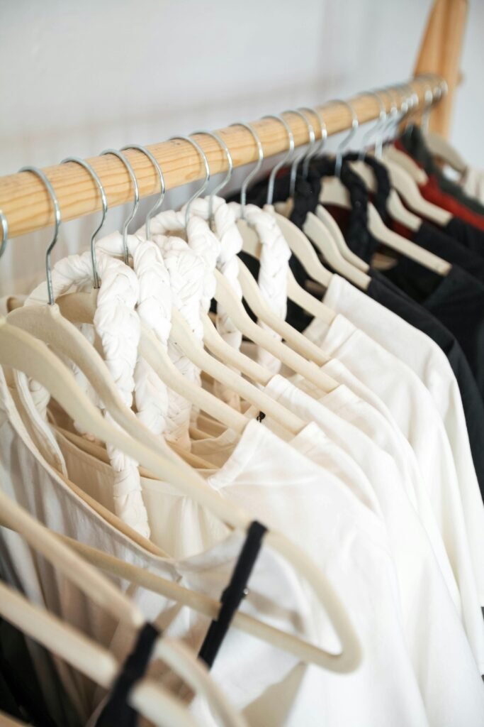Minimalist clothing rack featuring a black and white capsule wardrobe.